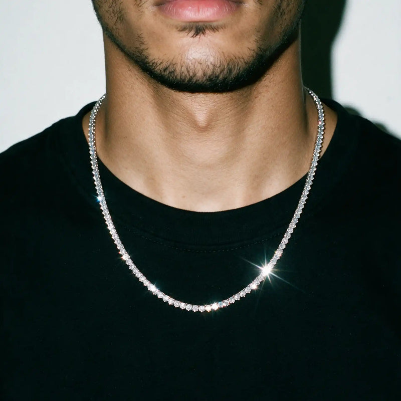 Silver 3MM tennis chain worn over a black tee