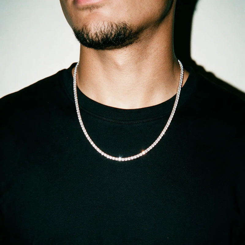 Silver 3MM tennis chain worn over a black tee