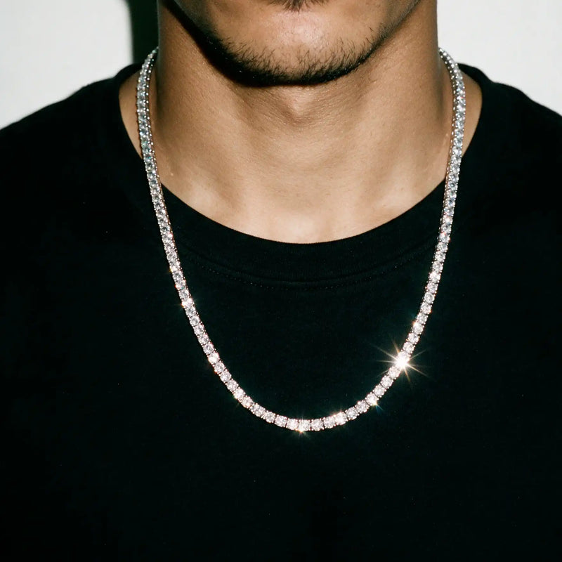 Silver 4MM tennis chain worn over a black tee