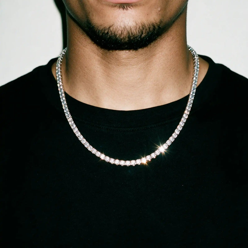 Silver 5MM tennis chain worn over a black tee