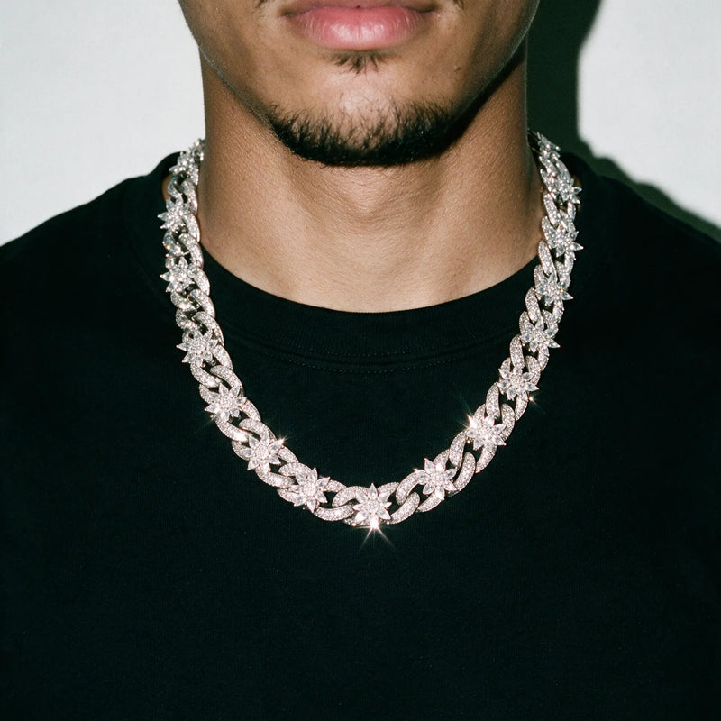 Silver 15MM Flora Fatale cuban chain worn over a black tee