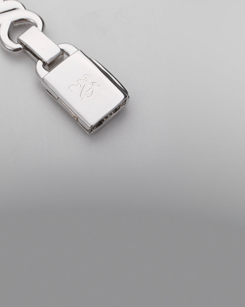 The clasp of a Nocta Vince bracelet, turned to show the monogram engraved inside
