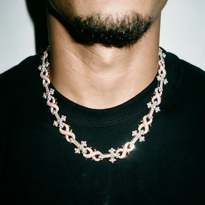 Rose gold 18MM Thorned Chrome chain worn over a black tee
